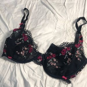 Navy balconette bra with floral appliqué details